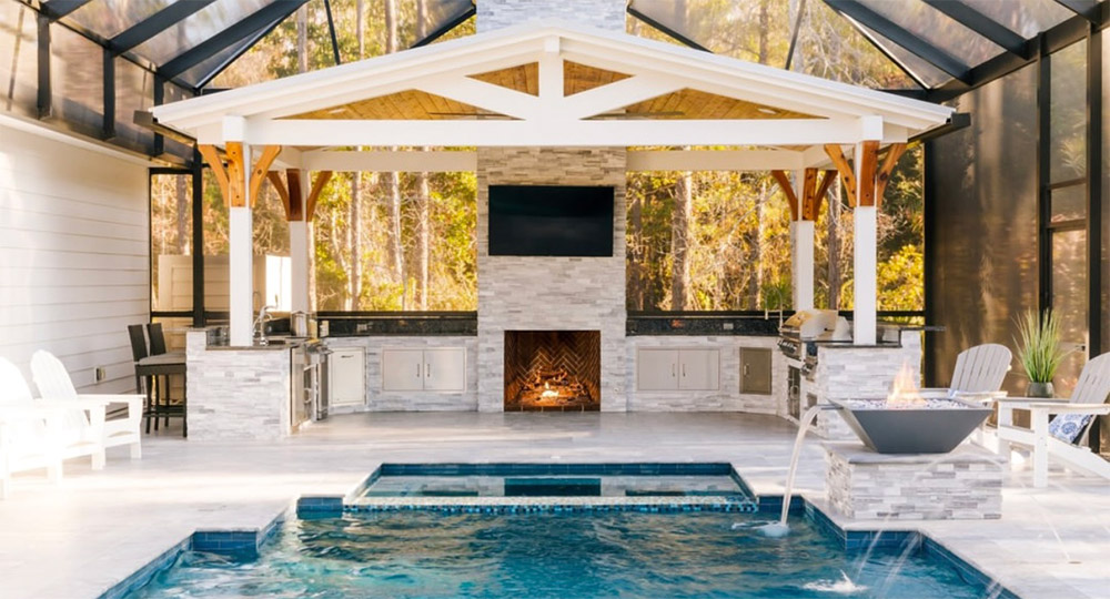 outdoor kitchen next to pool deck
